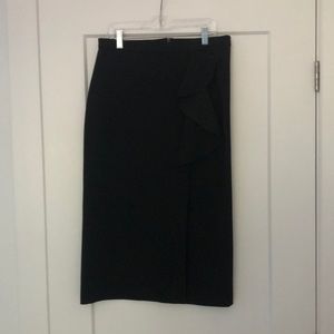 Black pencil skirt with slit and ruffle detailing